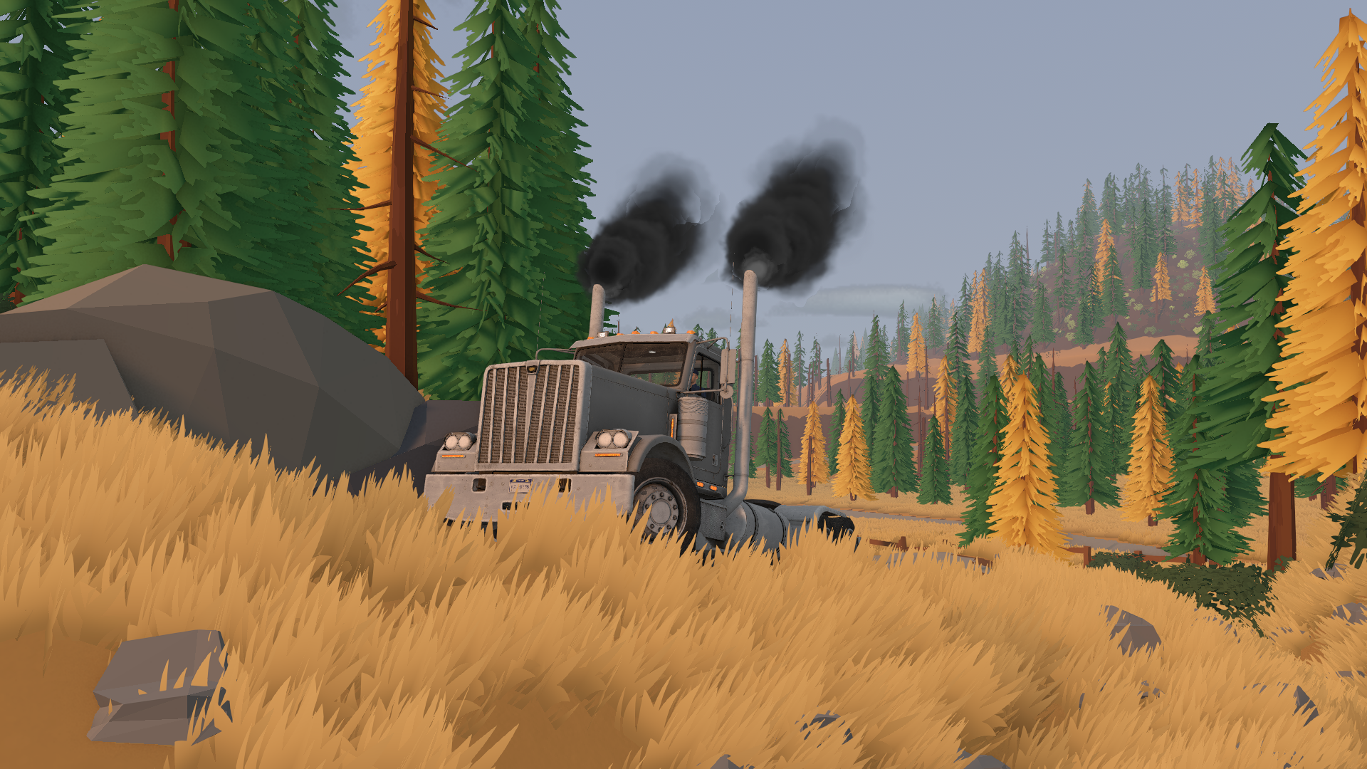 A heavy truck on a grassy slope surrounded by forest