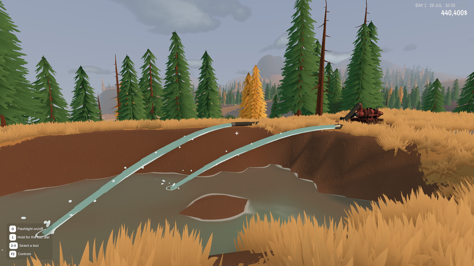 Two streams of pumped water flow into an excavation