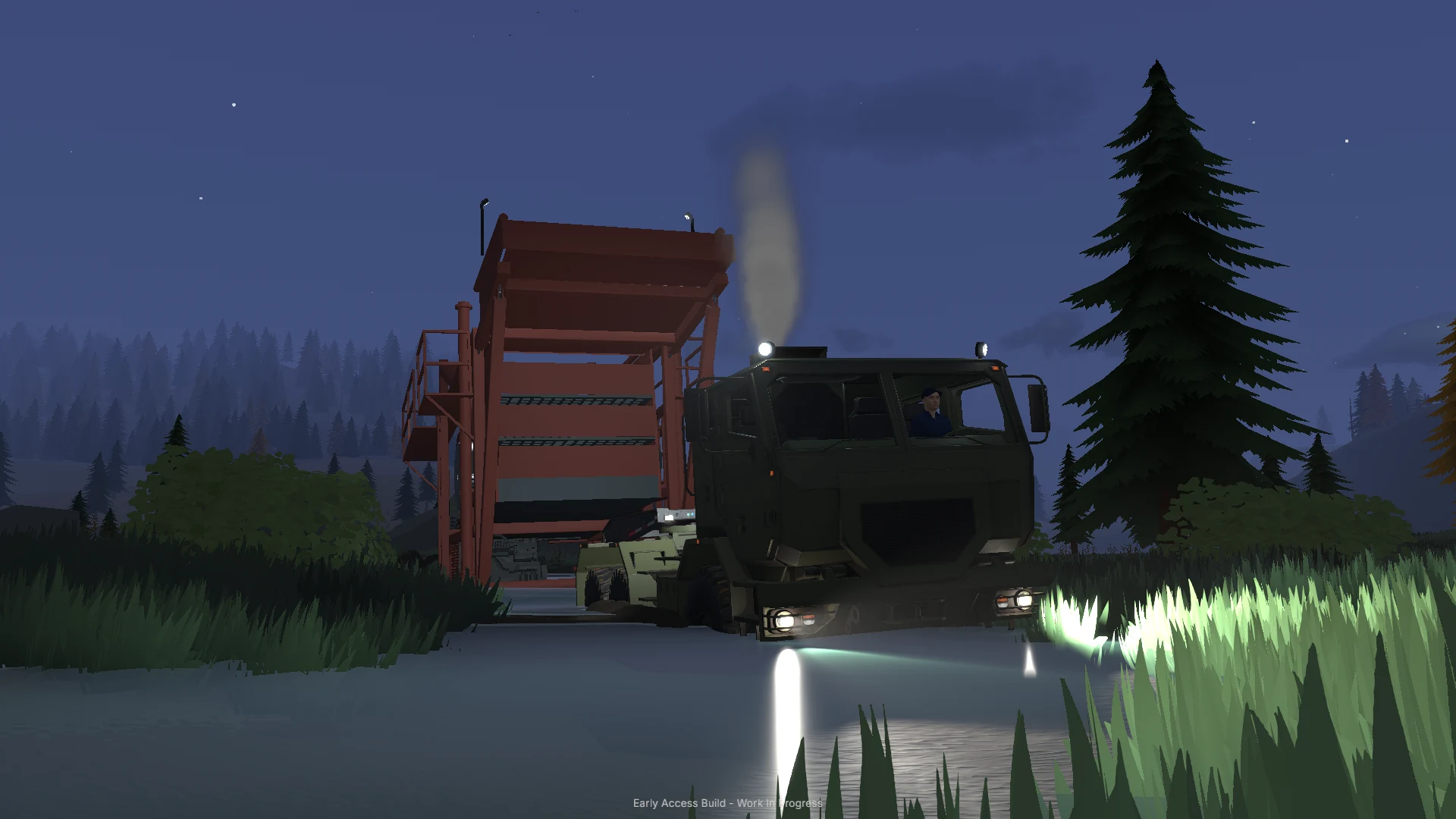 A dump truck tips its raised bed beside water at night.